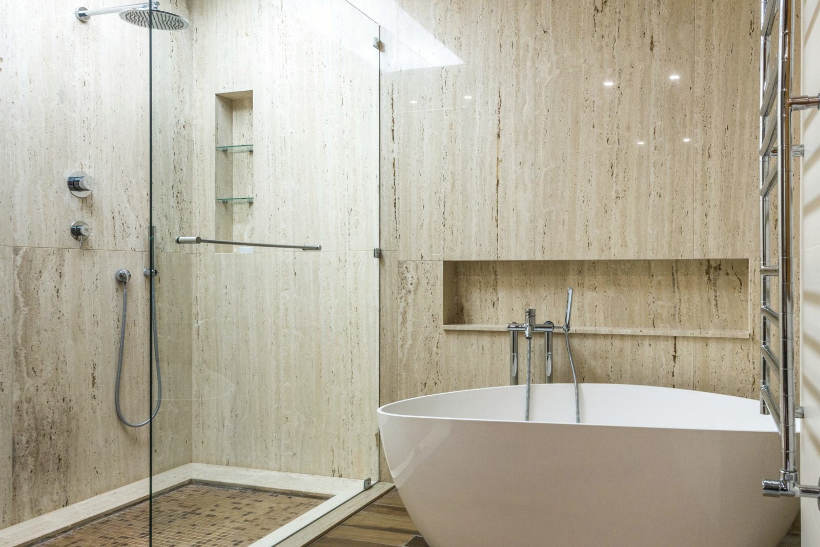 Bathroom with a freestanding bath, wood-look wall tiles and a shower niche